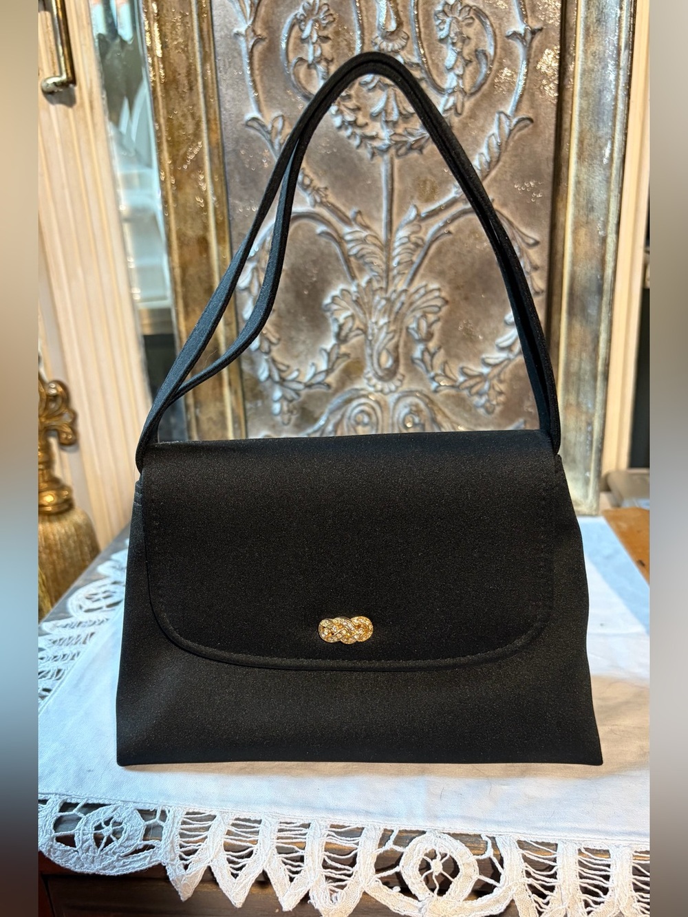 Classic little black handbag gold accents
